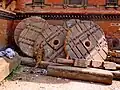 Wooden wheels of a disassembled festival cart for Bisket Jatra