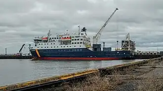 Motor vessel Bella-Desgagnes[22] loading at Rimouski-Est, port, St. Lawrence Estuary, Quebec
