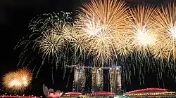 Image 22Fireworks over the Marina Bay skyline following the conclusion of the 2015 National Day Parade on 9 August 2015. (from History of Singapore)