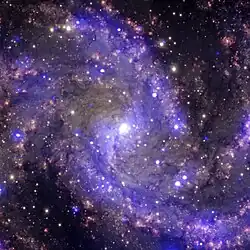 Image of a purple spiral galaxy