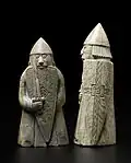 Face of a 'berserker' warder (rook) and profile of an ordinary warder at NMS
