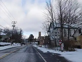 NY 42 and NY 52 entering Woodbourne. The Center Theatre is on the right.