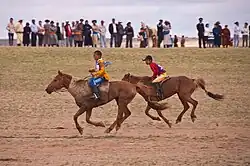 Two young riders across the finish line