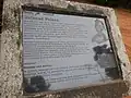 Plaque at the entrance of the palace