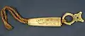 Needle carrier with bone cover suspended from a cord, Collection of Auckland Museum Tamaki Paenga Hira, undated