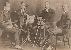 L-R: Felix Weir, Marion Cumbo, Hall Johnson, Arthur Boyd. Members of the Negro String Quartet prepare for performance.