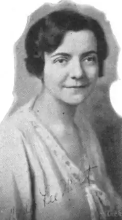 A young white woman with dark hair in a wavy bob style