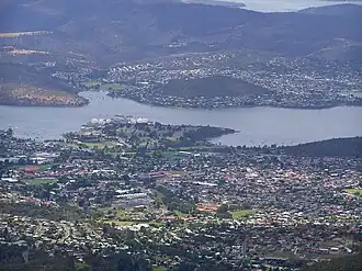 New Town viewed from Lost World to the west. New Town Bay is on the left and Cornelian Bay is on the right behind the suburb.