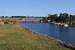 Looking south down the Nicholson River towards the Princes Highway road bridge from the East Gippsland Rail Trail