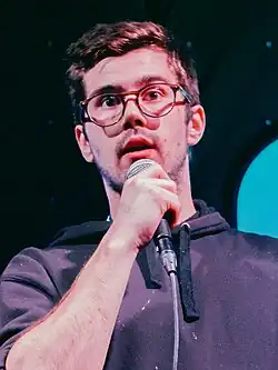 Mullen performing on stage.