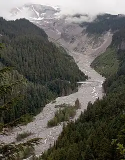 Near its source in Mount Rainier National Park, the Nisqually River flows under a bridge of Washington State Route 706