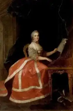 Victoire de France playing the harpsichord