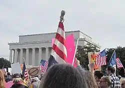 people walking in front of Lincoln memorial