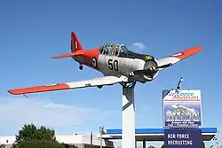 A former RNZAF North American Harvard mounted outside the Air Force Museum of New Zealand, a prominent feature of Sockburn