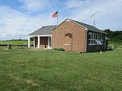 North Bass Island School, a one-room school with teacherage on Isle St. George of the Lake Erie Bass Islands was the last operating one-room school in Ohio. It ceased operations in 2005, and is maintained as an island heritage center.[23] K-8 students attended the school and flew to another island or the mainland for high school.