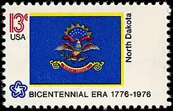 The North Dakota state flag as depicted in the 1976 bicentennial postage stamp series