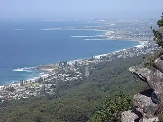 Lookout from the Illawarra escarpment above Wombarra over the northern Illawarra plain viewing Austinmer in the foreground, Thirroul, Bulli, Wollongong up to Port Kembla in the far distance.