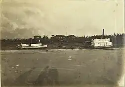 New river ice at Noochuloghoyet with two grounded steam ships, c.1884