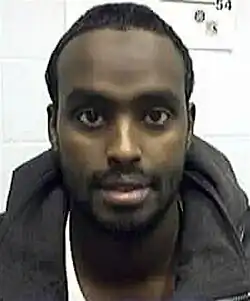 Headshot of Abdi, posed against a white background
