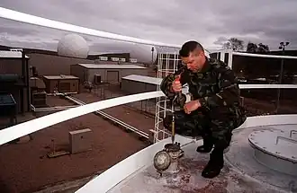 A member of the United States Air Force conducts maintenance at Nurrungar in December 1996