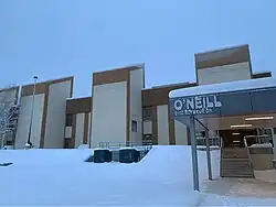 The building sits atop a hill, covered in snow.