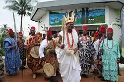 Photo of the current Obi of Onitsha; Igwe Alfred Achebe in his white regalia.