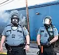 Officers of the Saint Paul Police Department in FM12 gas masks on 2020 George Floyd protests in the city