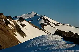 Old Snowy Mountain from the north, with the snow-covered McCall and Packwood Glaciers flanking the peak