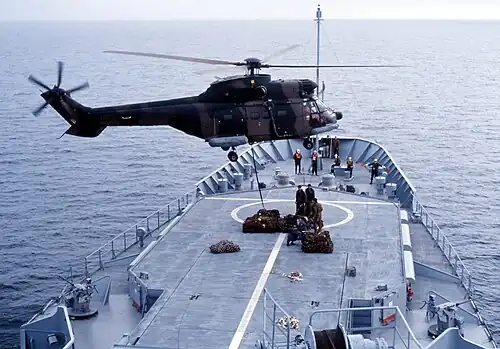 Oryx helicopter cargo-slinging off the SAS Drakensberg.