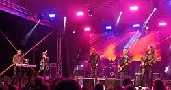 Osvajači performing in 2025
