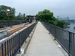 Top of the dam and bridge over the falls