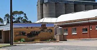 Silos and harvest mural at Owen in the west of the hundred