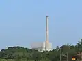 A close-up view of the Oyster Creek complex with the reactor building and off gas stack