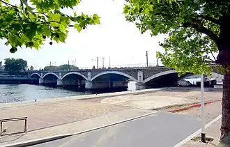 The first railroad bridge across the Seine (1852–53), originally called the Pont Napoléon-III, now called simply the Pont National.