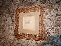 Framed Psalm from the Works on Paper exhibition. Front view