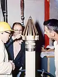 Engineers checking Pioneer 4, atop the fourth-stage motor of Juno II