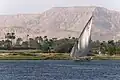 Photo. Small boat with 1 mast and trapezoidal sail, on the Nile
