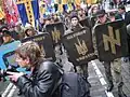 Patriot of Ukraine members on a march in 2007 sporting the symbol on signs