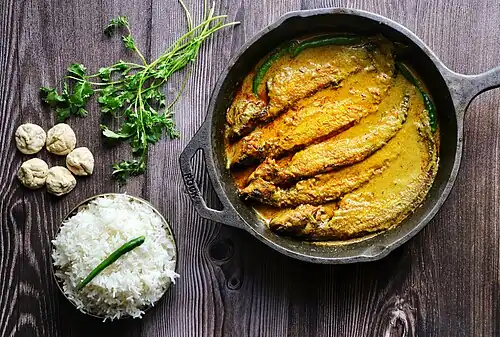 Machher jhol, a spicy fish curry eaten in eastern India, Nepal, and Bangladesh