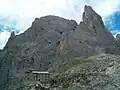 East aspect of Cima di Ball (center) and Campanile Pradidali (right) rise above Rifugio Pradidali