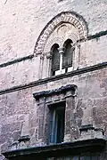 Gothic bifora window on the façade.
