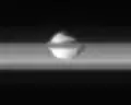 Equatorial view of Pan from Cassini, with the rings of Saturn surrounding the moon.