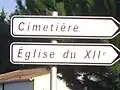 Signpost for the 12th century church and cemetery.