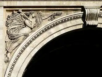 Figure of Pheme (northern façade, left spandrel)