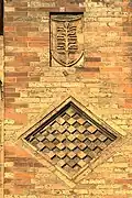 Detail of the checkered tile and palm