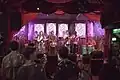 Musicians playing on the stage at Passing Clouds