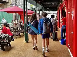 A couple passes through Seven Sisters Market’s food court