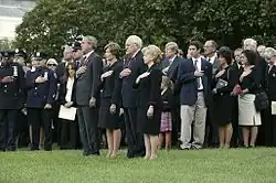 President George W. Bush and Vice President Dick Cheney lead a moment of silence on the South Lawn on September 11, 2004, with White House staff and families of victims of 9/11.
