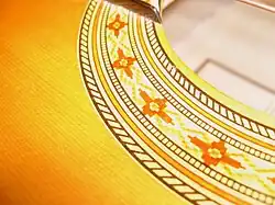 Many acoustic guitars incorporate rosette patterns around the sound hole.