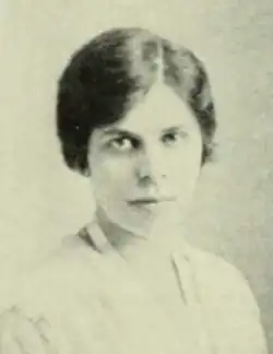 A young white woman with dark hair and eyes